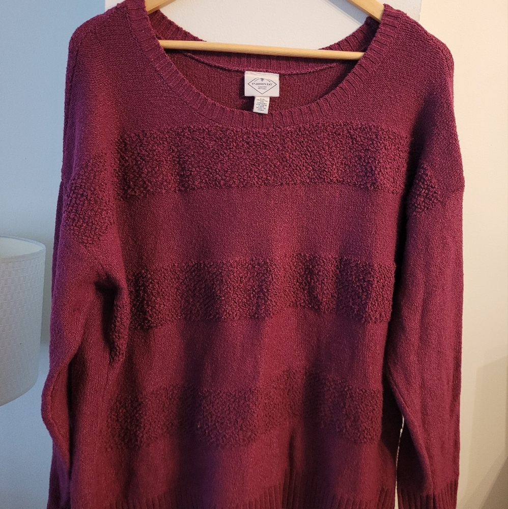 A burgandy Crew neck sweater